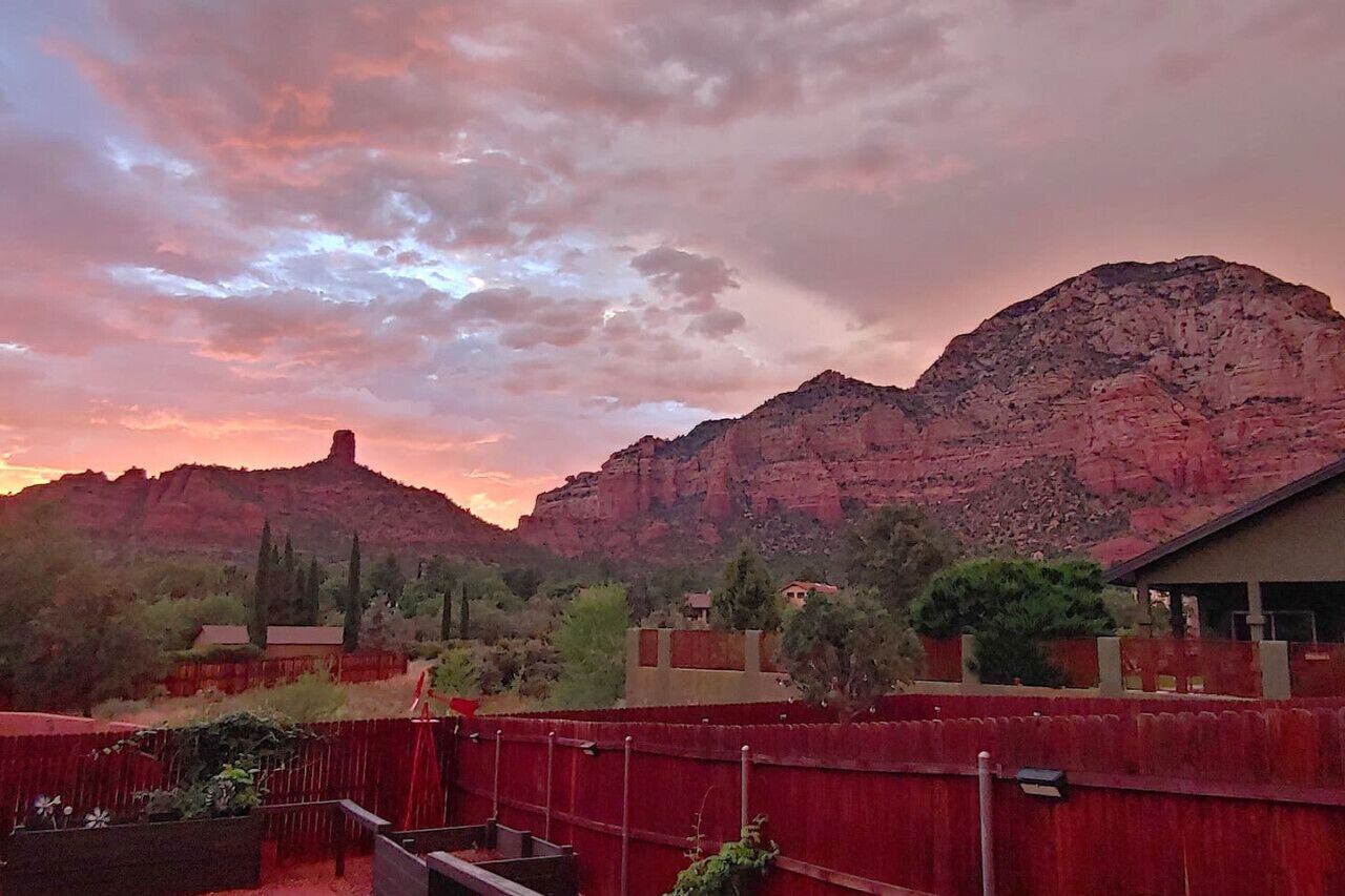 A mountainous landscape with a sunset.