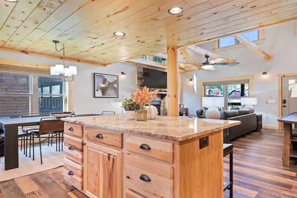 Bright, open space with a spacious kitchen island and cozy dining area.