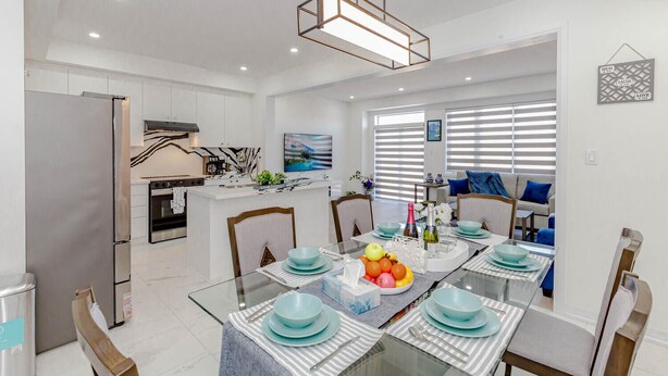 A modern kitchen with a dining area. - Amazing Home Niagara Fall .  (Thorold)