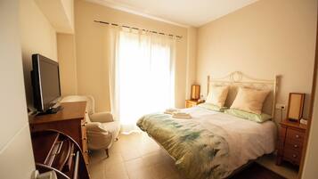 Desk, blackout curtains, iron/ironing board, travel cot