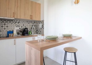 Fridge, microwave, stovetop, coffee/tea maker