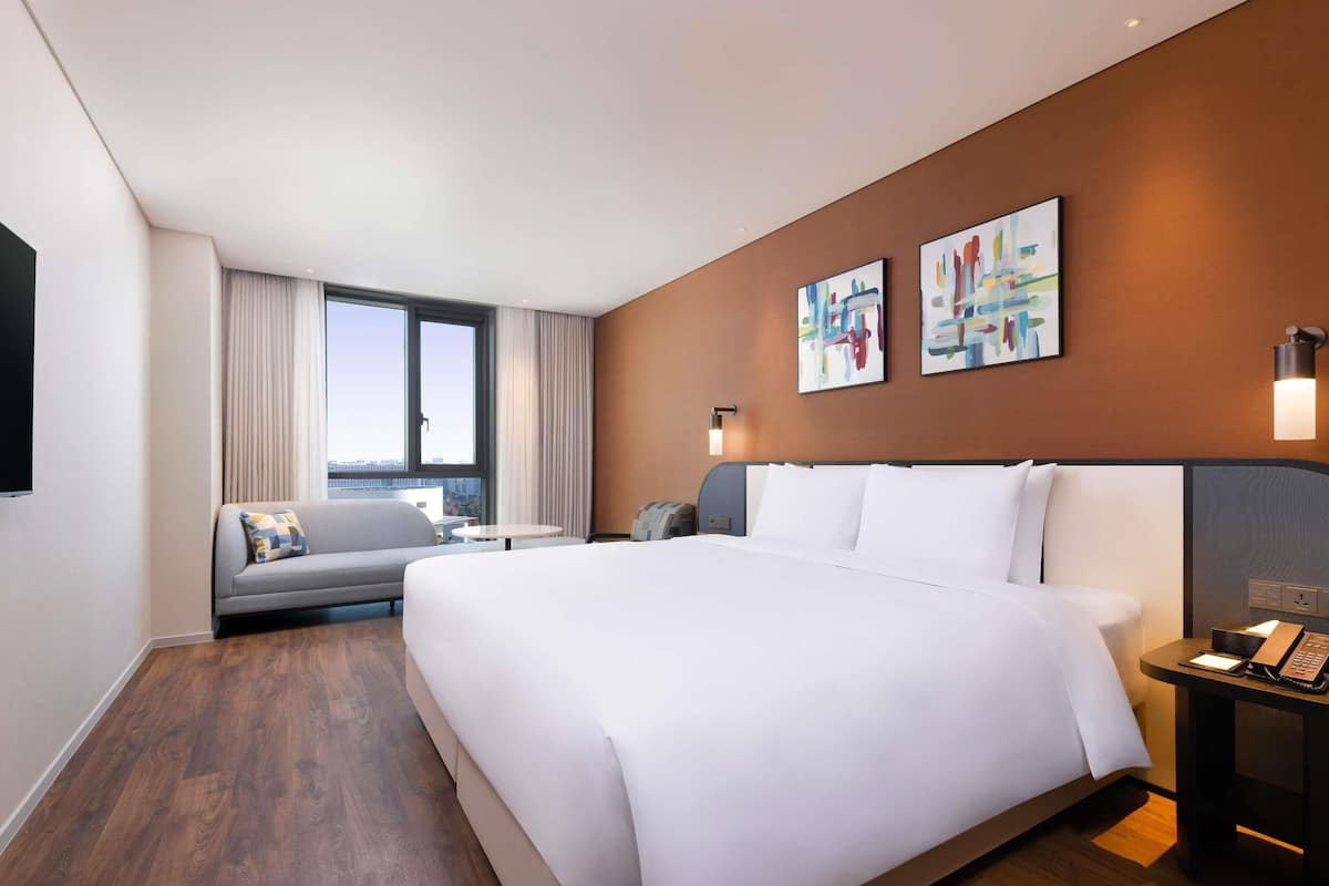 Chambre Deluxe, 1 très grand lit | Rideaux d’obscurcissement, système d’insonorisation