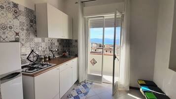Apartment, Partial Sea View | Private kitchen | High chair