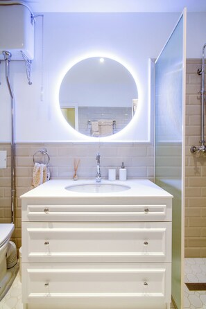 Shower, hair dryer, towels, soap