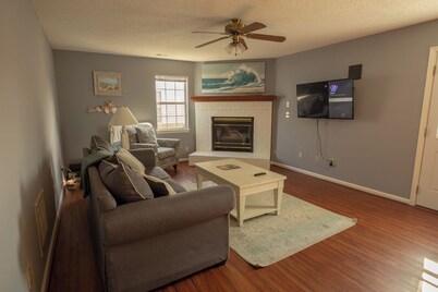 A quiet lakeside home for family, business, or both to relax or be productive.