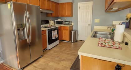 A quiet lakeside home for family, business, or both to relax or be productive.