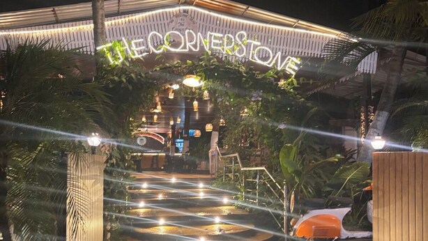 A well-lit entrance with a sign reading "The Cornerstone." - Dom Pedros Haven Resort - Tranquil Retreat by the Sea (Majorda)