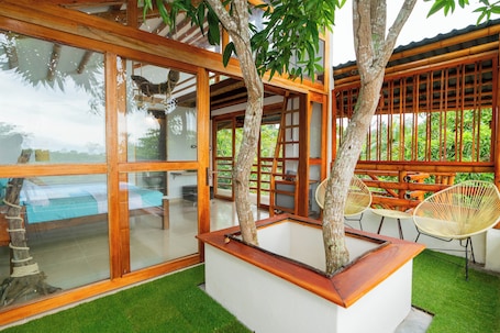 Deluxe Suite, Private Bathroom, Beach View | Desk, laptop workspace, soundproofing, free WiFi. Tayrona Juanchos House Hostel Coworking