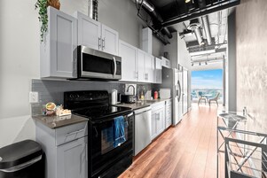 Deluxe Suite, Multiple Beds, Kitchen, City View | Private kitchen | Full-size fridge, microwave, oven, stovetop