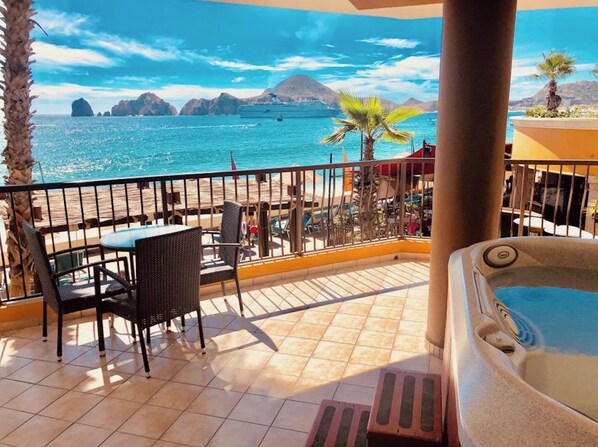 A balcony with a view of the sea, a hot tub, and outdoor seating. - Oceanfront 2BR Penthouse w/ Private Jacuzzi New Year’s Week 2027 Sleeps 6 (Cabo San Lucas)