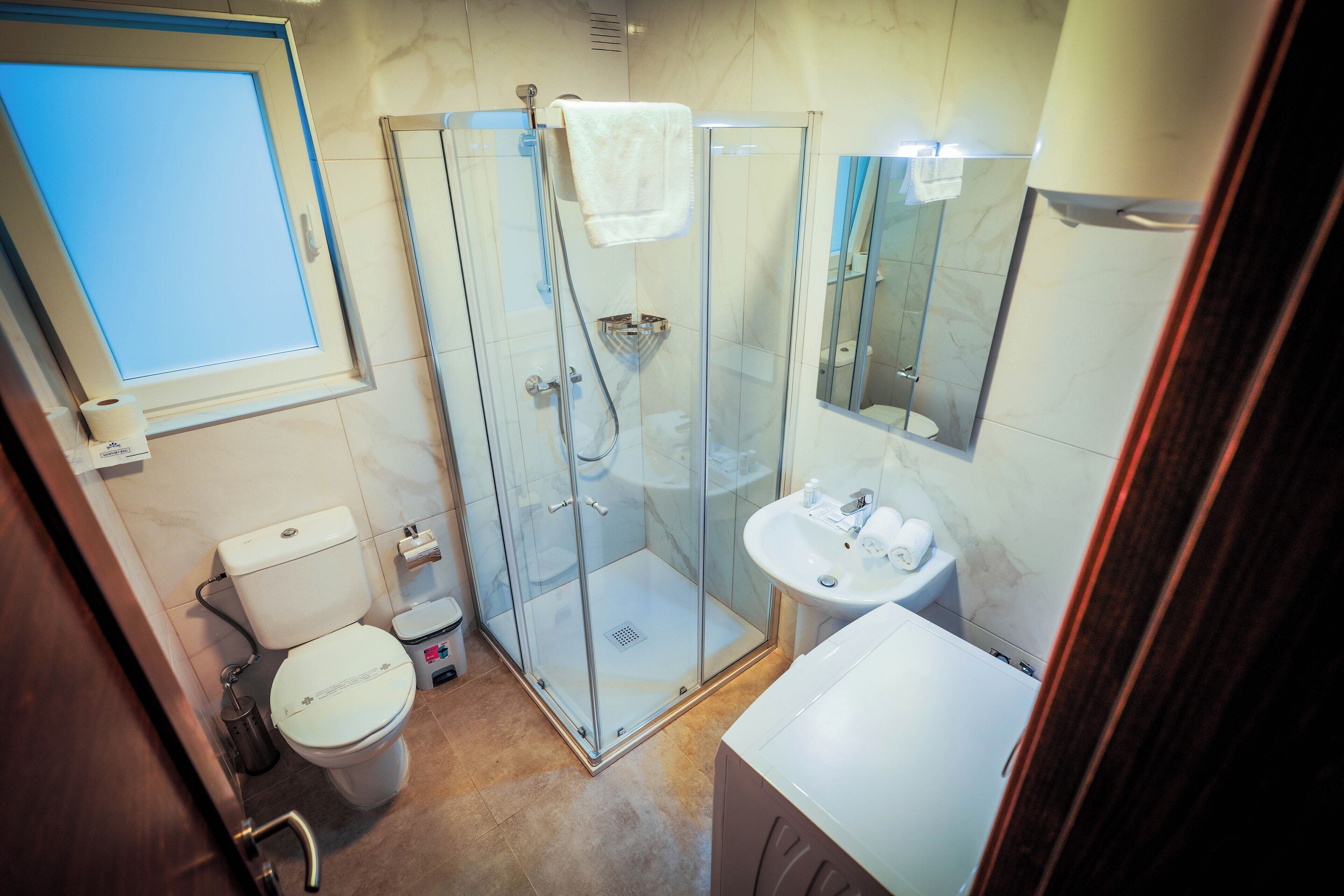 Shower, free toiletries, hair dryer, towels