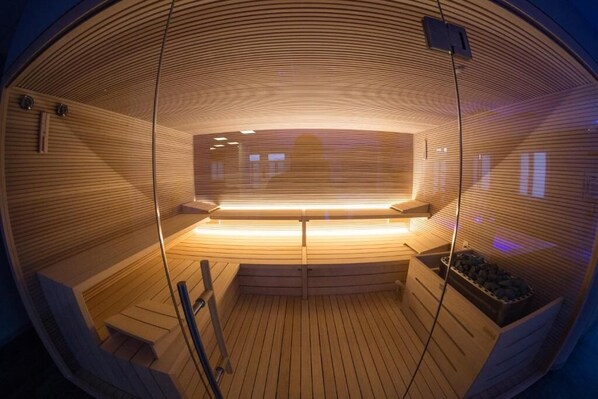 Sauna, hot tub, steam room, hot stone massages, deep-tissue massages
