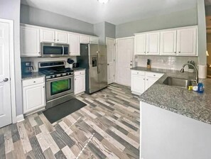 Fridge, microwave, oven, stovetop - New 3 BR House in Huntersville (Huntersville)