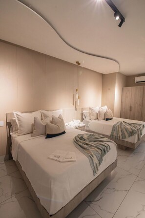 Chambre double, 2 lits jumeaux | Coffre-fort, décor unique, rideaux d’obscurcissement