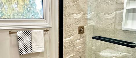 Shower, hair dryer, towels, soap
