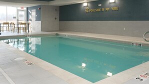 An indoor swimming pool with a sign on the wall that reads "POOLSIDE IS MY VIBE". - Home2 Suites By Hilton Lima (Lima)