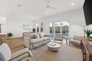 Deluxe Townhome, Partial Ocean View | Living area - Take it Easy by Book That Condo (Panama City Beach)