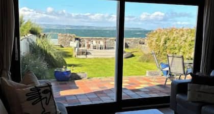 Splash Cottage Beach house with sea touching back garden