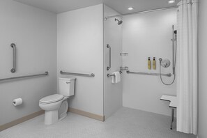 A bathroom with a toilet, shower, and grab bars. - Element by Marriott North Austin Tech Ridge (Austin)