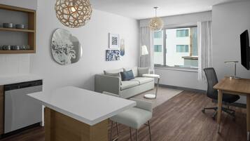 A modern hotel room with a kitchenette, a dining area, a sofa, a TV, and a large window with curtains.