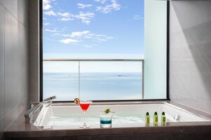 Designer toiletries, hair dryer, bathrobes, slippers