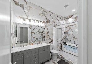 Shower, jetted tub, hair dryer, towels