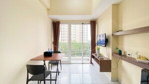 Deluxe Apartment | Living area - Minimalist And Cozy 1Br Casa De Parco Apartment (Pagedangan)