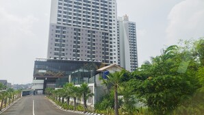 A high-rise building with the name "ASTON" on the top. - Good Place And Comfy Studio At Anwa Residence Apartment (South Tangerang)