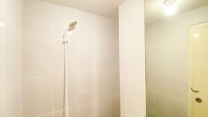 Deluxe Studio | Bathroom | Shower, free toiletries, towels, soap - Comfy And Minimalist Studio Apartment At Tokyo Riverside Pik 2 (Teluknaga)