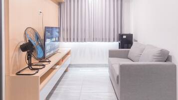 Apartamento Deluxe | Zona de estar