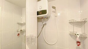 Deluxe Studio | Bathroom | Shower, free toiletries, towels, soap - Modern And Scenic Studio At Tokyo Riverside Pik 2 Apartment (Teluknaga)
