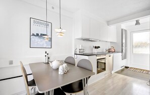 Fridge, stovetop, dishwasher, coffee/tea maker