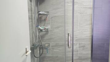 Shower, hair dryer, towels, soap