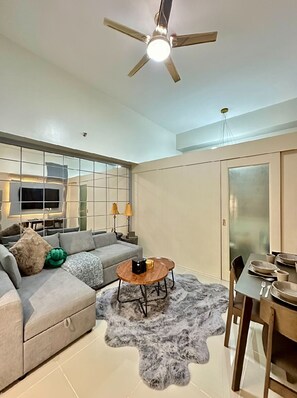 Smart TV - Suite 101F - Mall of Asia’s Sunrise Drive Oasis is a spacious, 1-bedroom condo  (Pasay City)