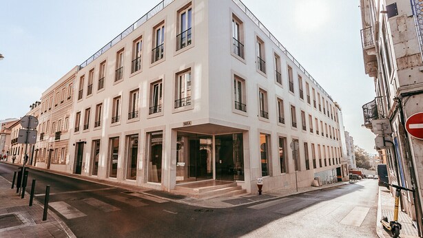 A modern building with multiple windows and a ground-level entrance. - Elegant & Sophisticated by GT House (Lisbon)