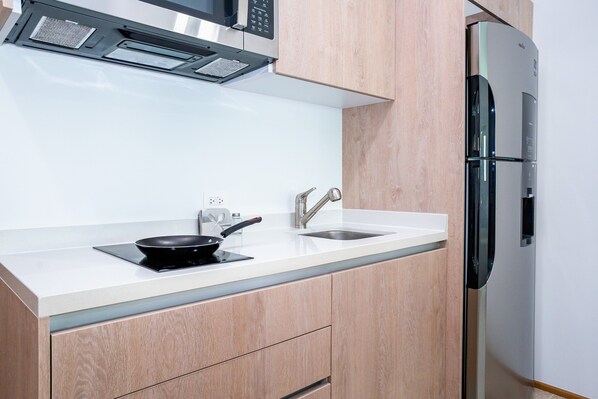 Fridge, microwave, stovetop, coffee/tea maker