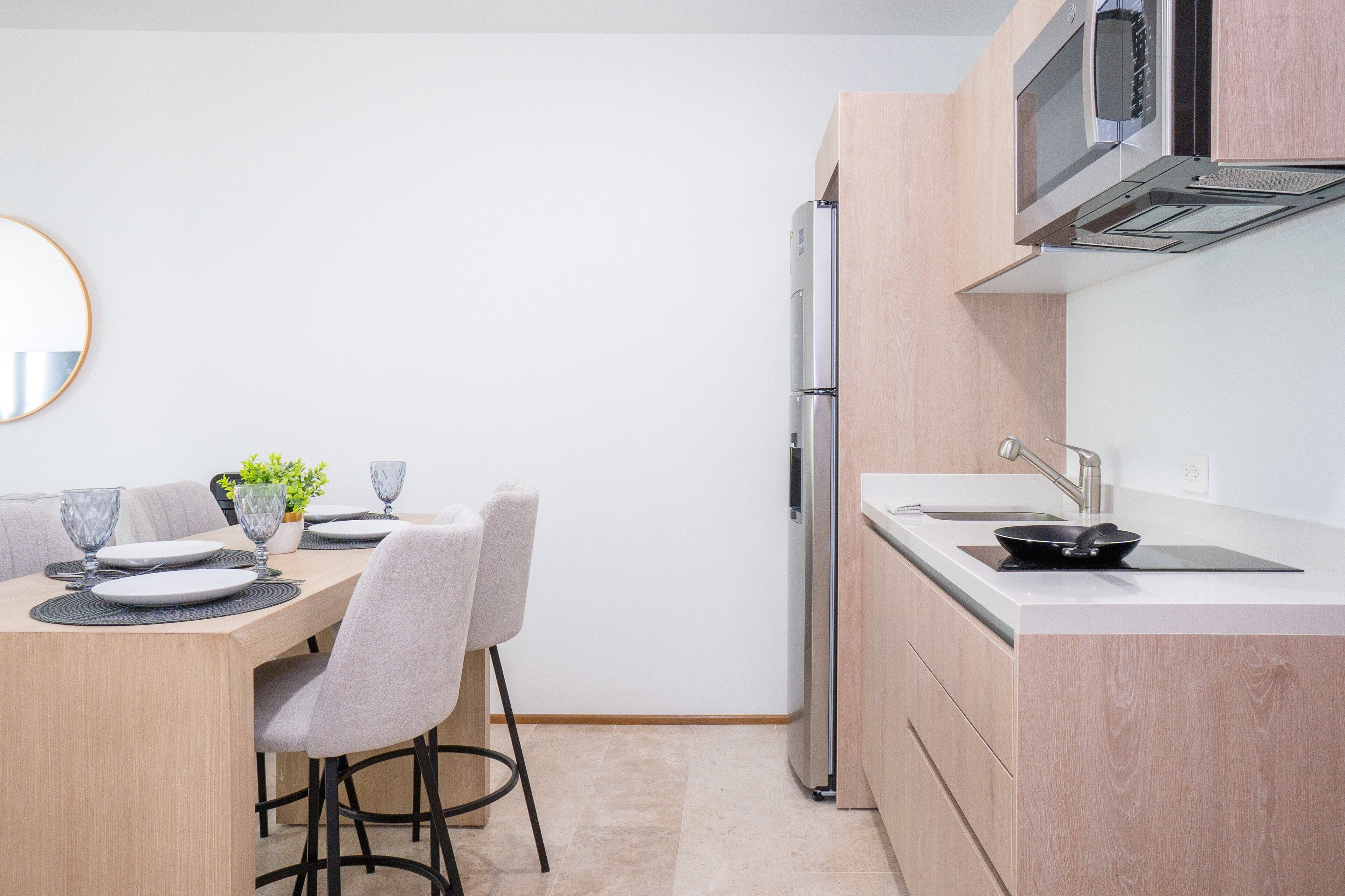 Fridge, microwave, coffee/tea maker, cookware/dishes/utensils