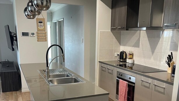 Fridge, microwave, oven, stovetop - Modern Four Bedroom Holiday Home Available in Deebing Heights (Deebing Heights)