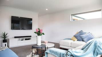Executive House, 4 Bedrooms, Garden View | Living area | Flat-screen TV