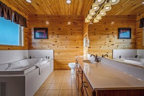 Jetted tub, hair dryer, towels, toilet paper