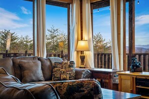Living area - Stunning views! 6-bedroom cabin w/arcade, pool table, hot tub, foosball & more! (Sevierville)