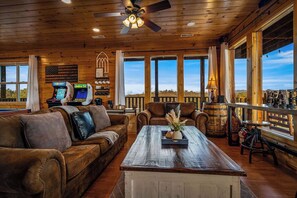 Living area - Stunning views! 6-bedroom cabin w/arcade, pool table, hot tub, foosball & more! (Sevierville)