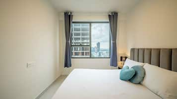 Desk, laptop workspace, blackout drapes, iron/ironing board