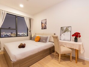 Deluxe Apartment, 3 Bedrooms, City View | Desk, laptop workspace, blackout curtains, iron/ironing board