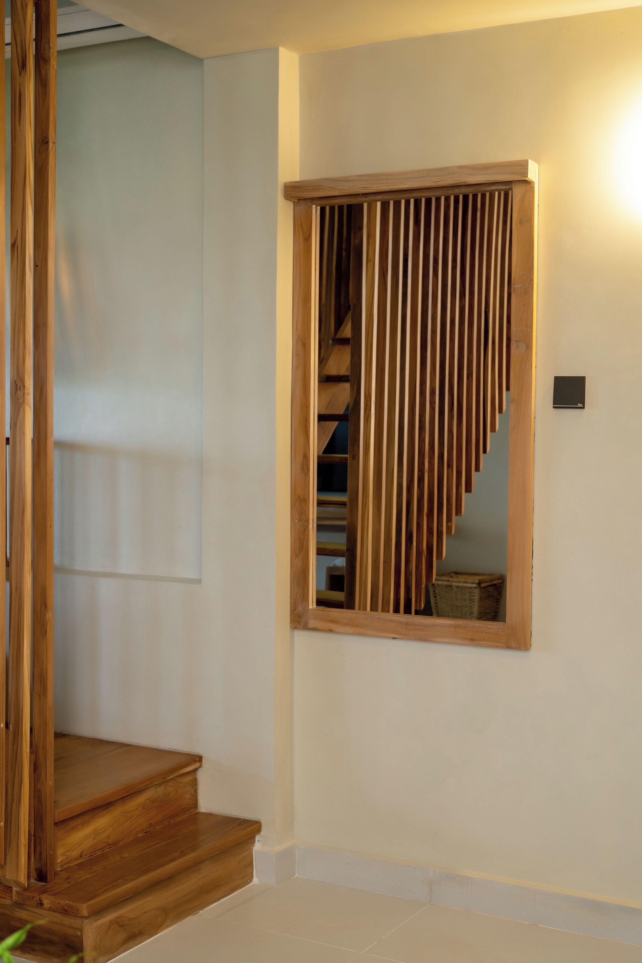 A staircase with wooden steps and a wooden railing.