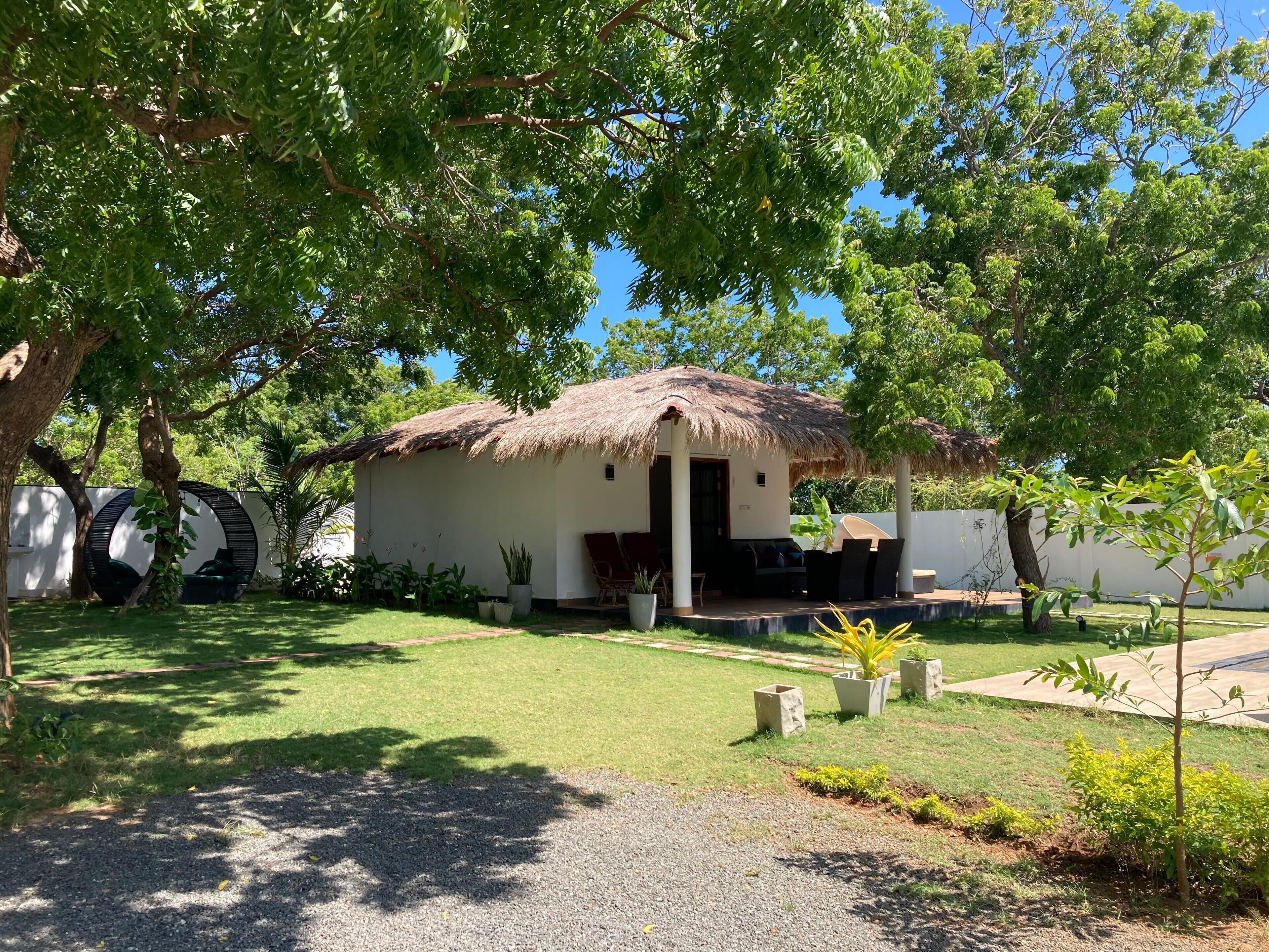 Deluxe Bungalow, Pool View | In-room safe, individually decorated, individually furnished, desk