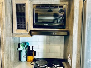 Fridge, microwave, stovetop, coffee/tea maker