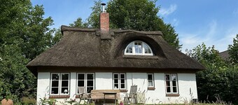 Thatched Holiday Home 'Kate Unter Reet Im Grünen' with Private Terrace, Garden, and Wi-Fi