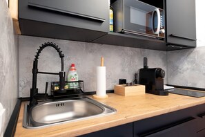 Fridge, microwave, stovetop, coffee/tea maker