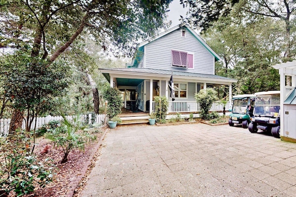 This secluded home includes two 4-seater golf carts